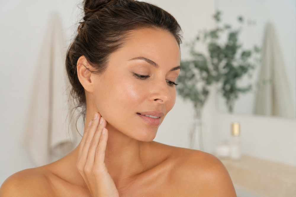 Woman with smooth hydrated facial skin in soft natural light
