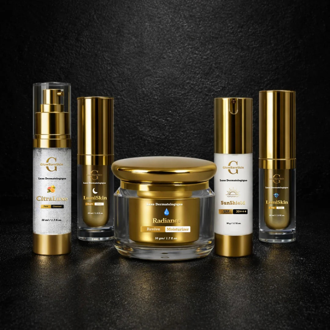 Set of skincare products with gold and clear design on a dark background