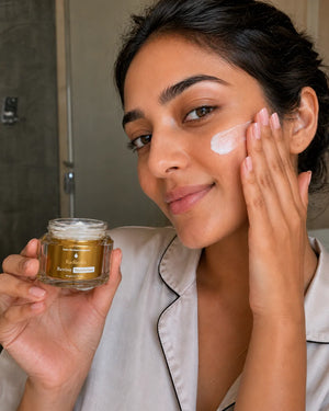 Woman applying GlowBareSkin Radiance Revive Moisturizer on her face, demonstrating the lightweight, non-greasy moisturizer for sensitive, dry and dehydrated skin.